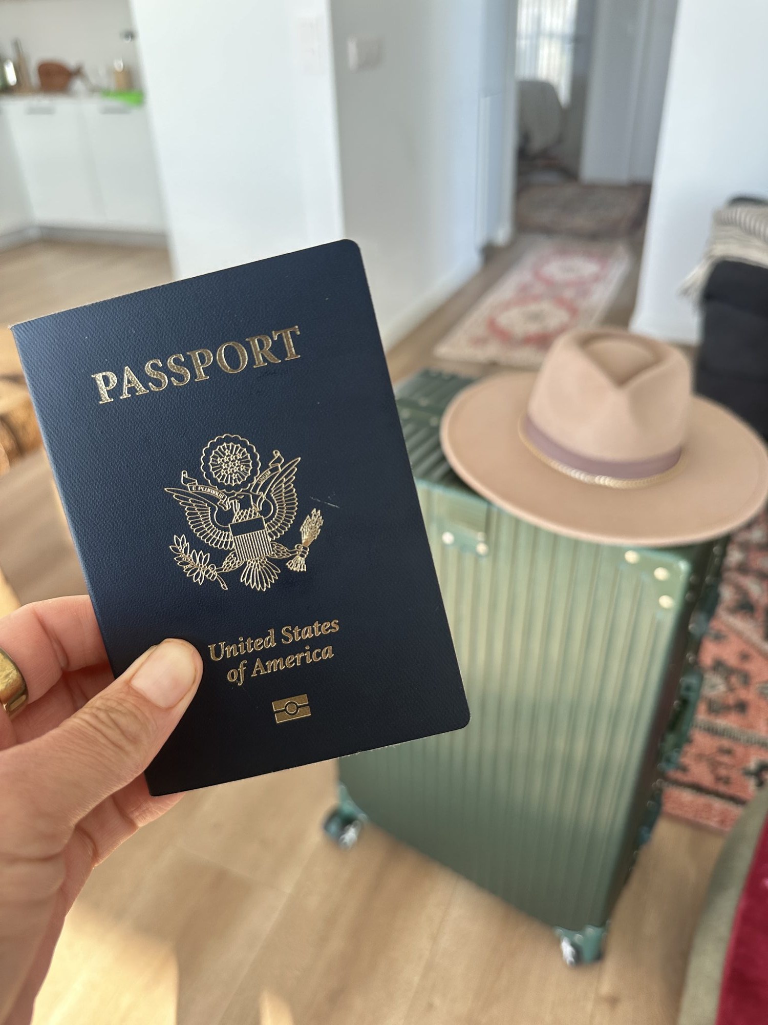 Holding up a well-worn passport