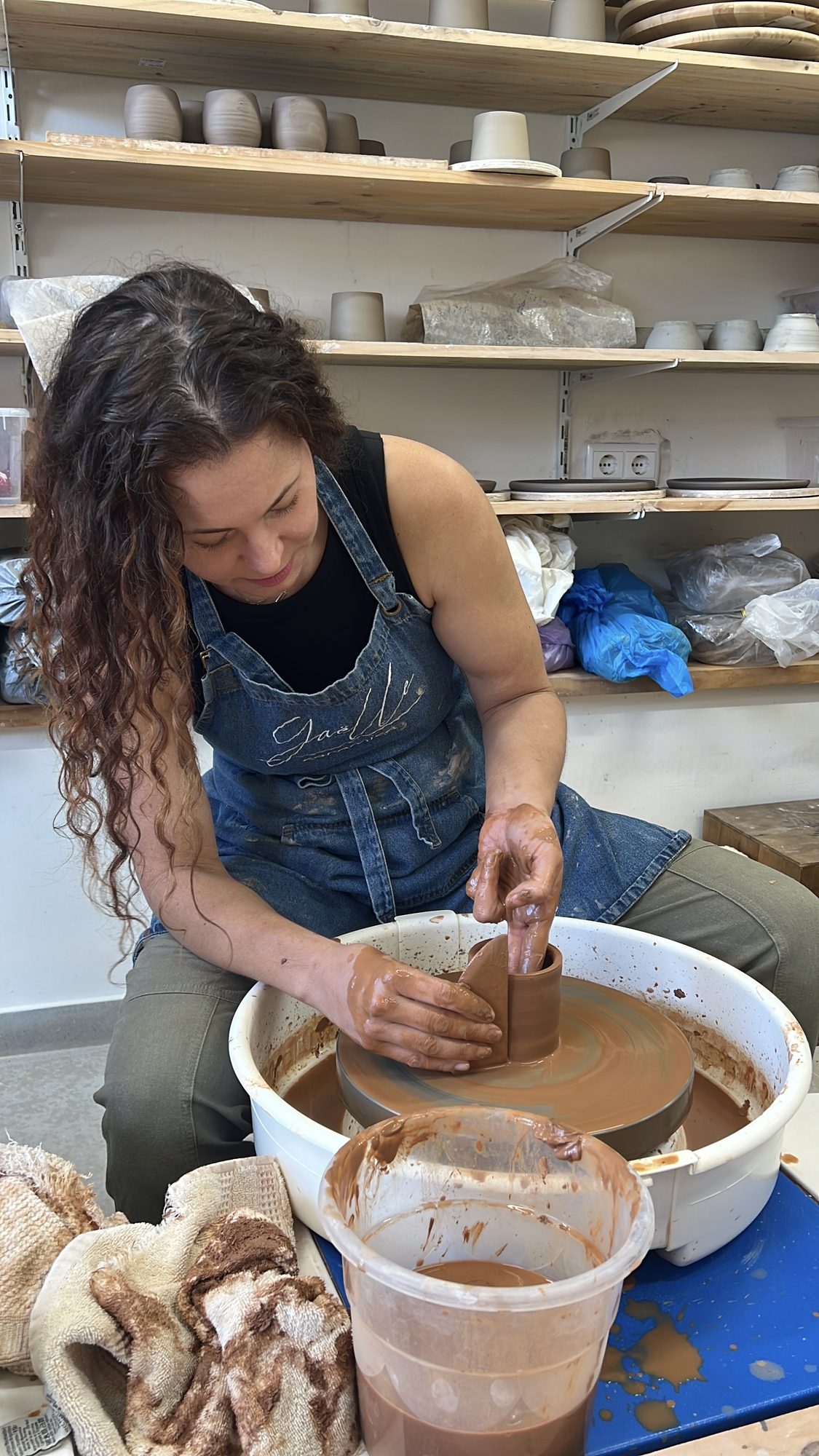 Erin at the pottery wheel